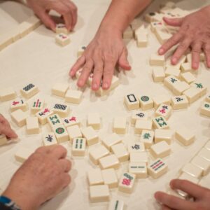 Person playing white and brown lego blocks