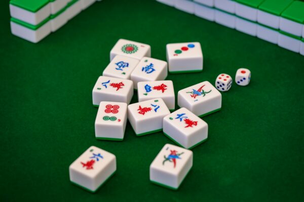 A group of dices sitting on top of a green table